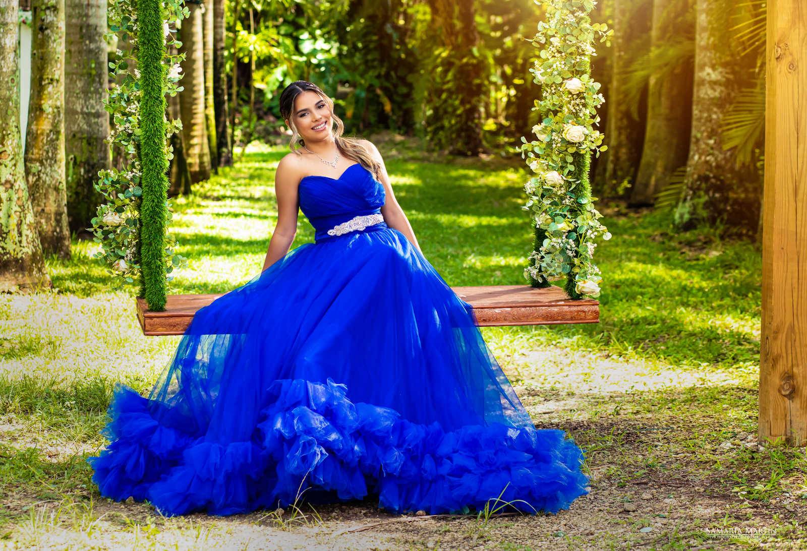 Gorgeous smile of a Quinceanera sitting on a swing at Villa Turqueza, Miami